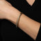 Bracelet Bracelet manchette en or jaune 18 carats serti de diamants, signé David Yurman 58 Facettes G13729