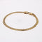 Bracelet Bracelet en or occasion gourmette aplatie 58 Facettes 24-330