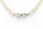 Collier Collier Années 70 en or blanc 18 carats, émeraude et perles 58 Facettes B677