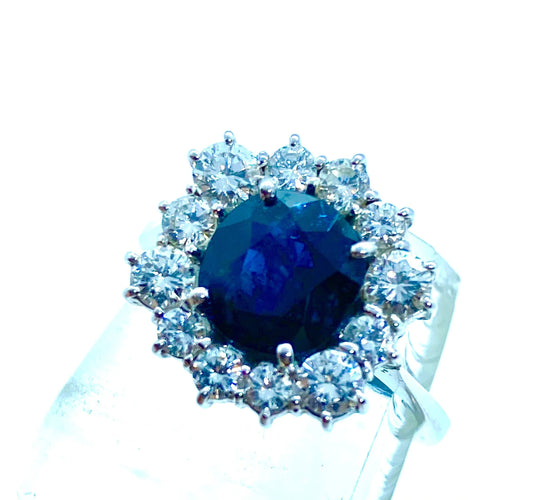 Bague Bague hexagonale sertie de diamants et ornée d'un saphir central 58 Facettes