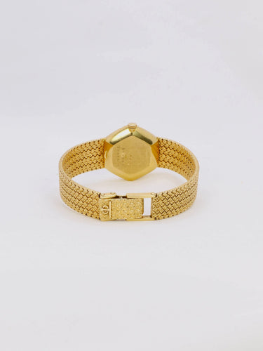Montre BAUME & MERCIER - Montre vintage or jaune maille tressée 58 Facettes 1067.3