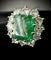 Bague 56 Bague or blanc sertie d'une émeraude de 4 carats entourée de 2,40 carats de brillants 58 Facettes