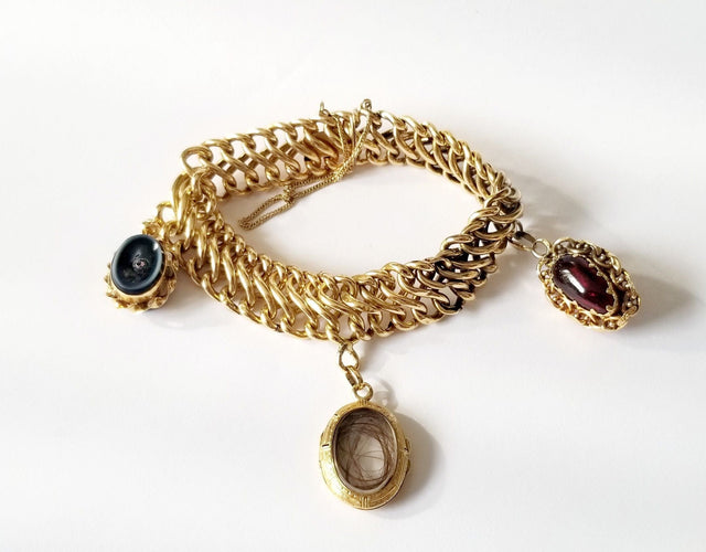 Bracelet Bracelet maille américaine or jaune 18 carats et breloques - 17 cms - 36.25 grs 58 Facettes