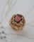 Bague 50 Bague Dôme Fleur Or Jaune et Grenat 58 Facettes A11212
