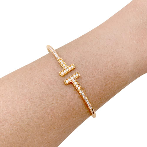 Bracelet Bracelet Tiffany "Wire Tiffany T" en or rose et diamants. 58 Facettes 34827
