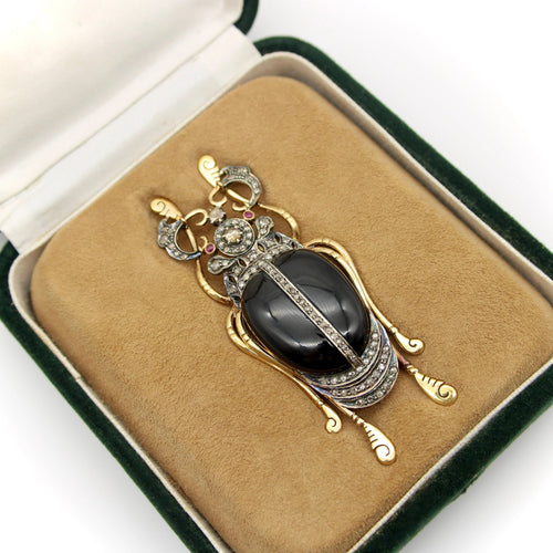 Broche Broche scarabée en or et argent avec diamants, onyx et rubis 58 Facettes