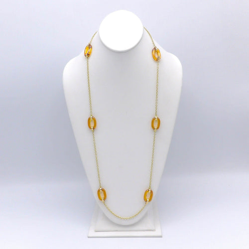 Collier Collier à maillons ovales en or et verre ambré sculpté 58 Facettes 10027