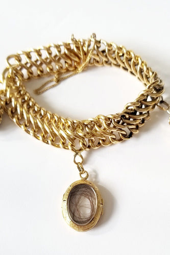 Bracelet Bracelet maille américaine or jaune 18 carats et breloques - 17 cms - 36.25 grs 58 Facettes