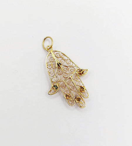 Pendentif Pendentif vintage or jaune Main de fatma orné de turquoises (circa 1950) 58 Facettes A04727