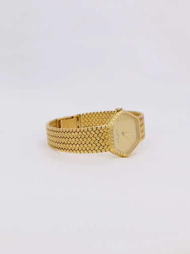 Montre BAUME & MERCIER - Montre vintage or jaune maille tressée 58 Facettes 1067.3