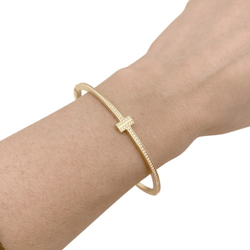 Bracelet Bracelet Tiffany & Co., "Tiffany T", or jaune, diamants. 58 Facettes 34364