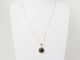 Collier Collier pendentif marguerite en or jaune et grenats 58 Facettes 33127