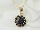 Collier Collier pendentif marguerite en or jaune et grenats 58 Facettes 33127