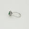 Bague 57 Bague Marguerite or gris, émeraude et diamants 58 Facettes CAN1063