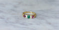 Bague 49 Bague jarretière or jaune émeraudes rubis et diamants 58 Facettes