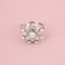 Bague 53 BUCHERER Bague florale en or blanc et diamants 58 Facettes