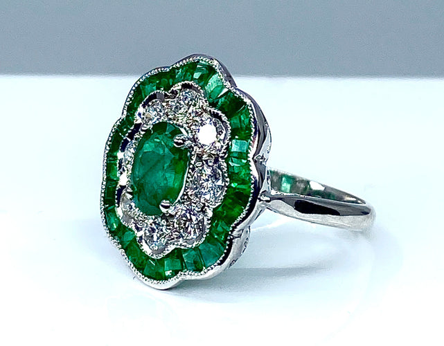 Bague Bague marguerite en or blanc 18 carats en émeraudes et diamants 58 Facettes AB216