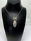 Collier Pendentif et sa chaine en argent : enfant sur email et pierres blanches. Vers 1900 58 Facettes AB386