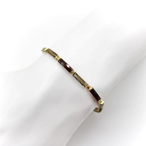 Montre Bracelet vintage en or 14 carats avec grenat et quartz fumé 58 Facettes A2000P