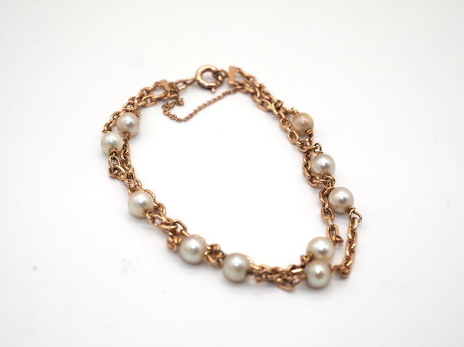 Bracelet Bracelet en or jaune et perles blanches 58 Facettes