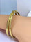 Bracelet Bracelet double joncs, or blanc, diamants, Yves Saint Laurent 58 Facettes AB601