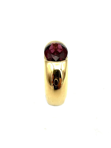 Bague 51 CARTIER. Collection "Ellipse", bague or jaune et grenat 58 Facettes