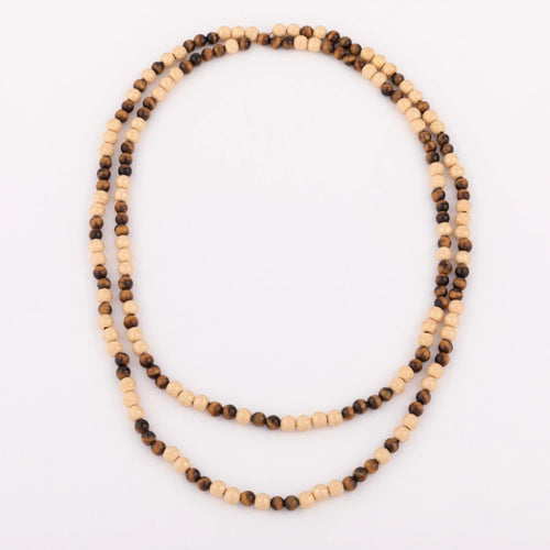 Collier Sautoir en perles d'or ciselés et perle yeux de tigre 58 Facettes 1