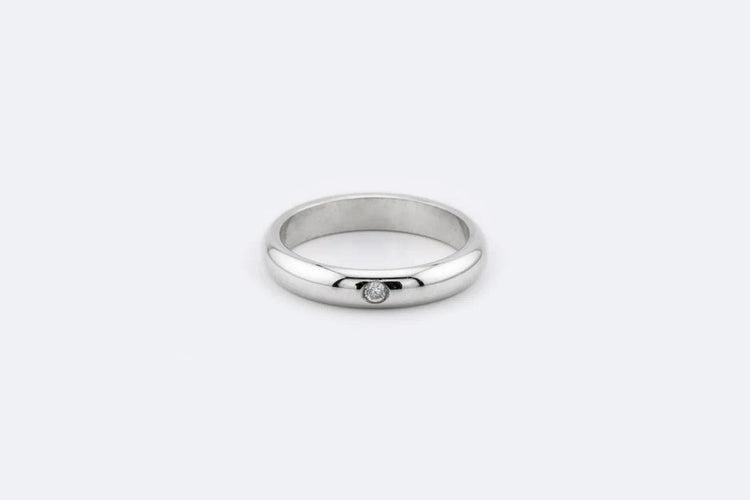 Bague Alliance en or blanc sertie d'un diamant 58 Facettes anl515