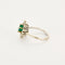 Bague 55 Bague Marguerite or gris et jaune, diamants et émeraude 58 Facettes 250256