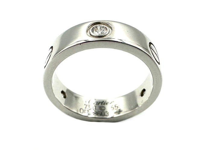 Bague 55 CARTIER. Collection "LOVE", bague en or blanc 18K et 3 diamants 58 Facettes