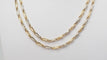 Collier Collier Sautoir Cartier en or jaune grain d' avoine 58 Facettes 32383