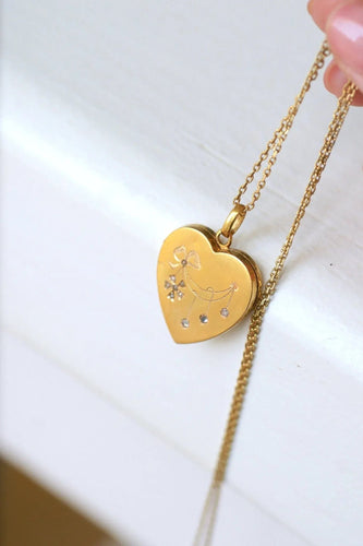 Pendentif Médaillon cœur ouvrant en or, diamants, et perles 58 Facettes