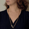 Collier Chaîne en or jaune et coulant Serpent en or gris et diamants et émeraude 58 Facettes SNA1712