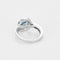 Bague 49 Bague tourbillon en or blanc, topaze et diamants 58 Facettes B250558