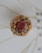 Bague 50 Bague Dôme Fleur Or Jaune et Grenat 58 Facettes A11212