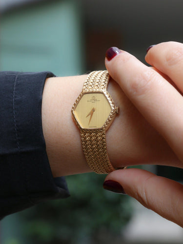 Montre BAUME & MERCIER - Montre vintage or jaune maille tressée 58 Facettes 1067.3