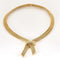 Collier Collier négligé en or jaune tressé 58 Facettes MON0828