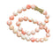 Collier Collier en perles de corail peau d'ange et fermoir or jaune 18 carats 58 Facettes 356