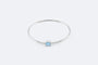 Bracelet Oro Bianco Bracciale rigido in oro bianco con topazio azzurro e zirconi 58 Facettes 197,00 BRC