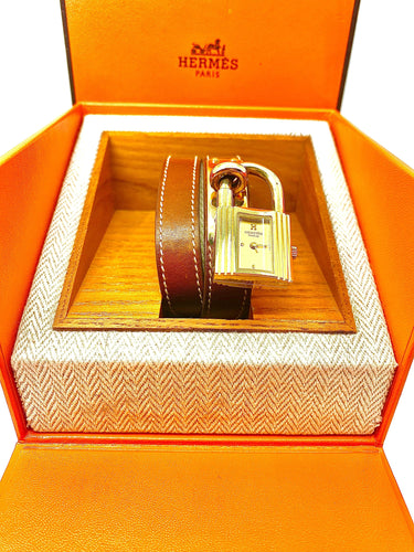 Montre Montre Hermès «  Kelly », cadran PM plaqué or, double tour cuir marron 58 Facettes AB453