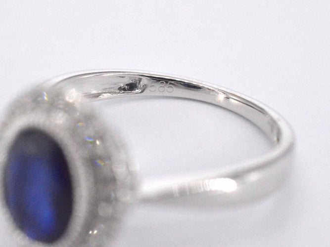 Bague 54 Bague entourage en or blanc avec diamants et saphir 58 Facettes 2044