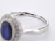 Bague 54 Bague entourage en or blanc avec diamants et saphir 58 Facettes 2044