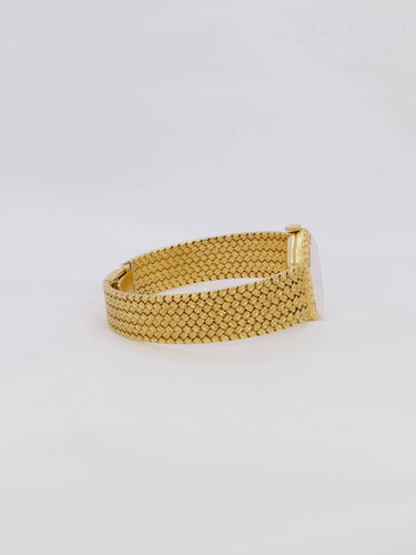 Montre BAUME & MERCIER - Montre vintage or jaune maille tressée 58 Facettes 1067.3
