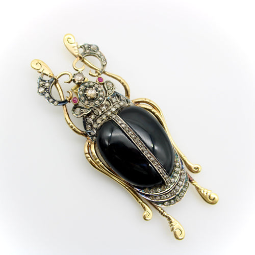 Broche Broche scarabée édouardienne en or 18 carats et argent sterling avec diamants taille rose, onyx et rubis 58 Facettes