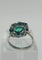 Bague 59 Bague en platine avec une émeraude, des diamants et des saphirs. 58 Facettes 50230