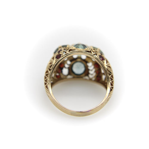 Bague Bague bombée en or avec topaze bleue victorienne et grenat 58 Facettes A20050