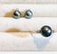 Bague 56 Bague en or sertie d'une perle de culture grise entourée de 2 diamants 58 Facettes 2920 A