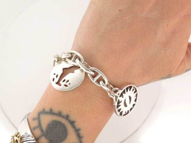 Bracelet vintage bracelet HERMES chaine d'ancre breloques marines t16 en argent 925 58 Facettes 267839