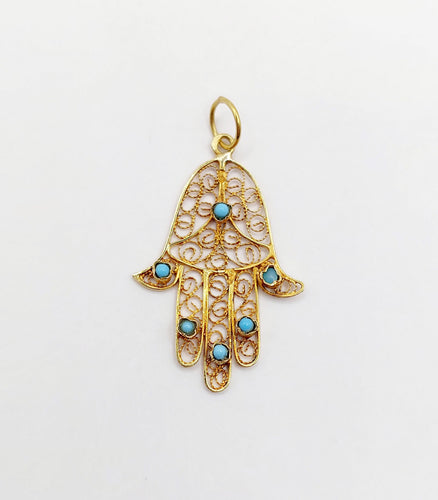 Pendentif Pendentif vintage or jaune Main de fatma orné de turquoises (circa 1950) 58 Facettes A04727