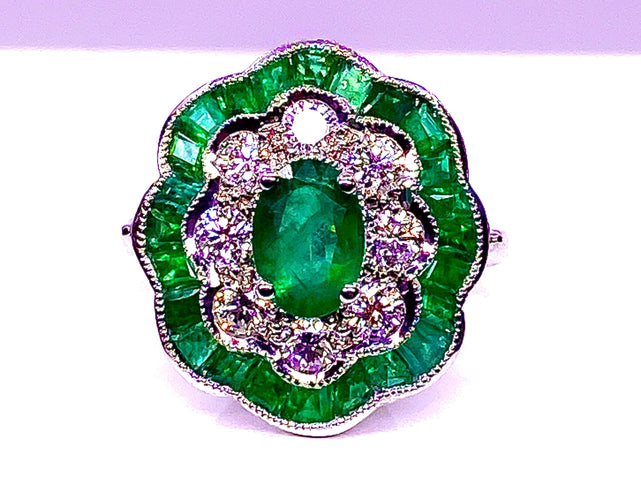 Bague Bague marguerite en or blanc 18 carats en émeraudes et diamants 58 Facettes AB216